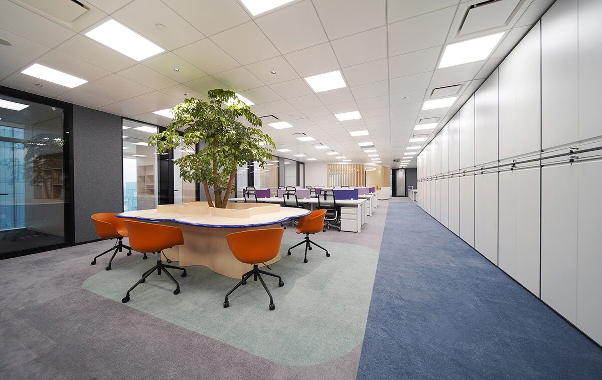 Blue and gray commercial carpet tiles installed in a modern office